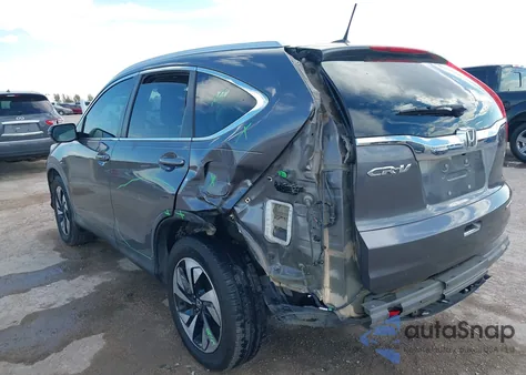 2015 Honda Cr-V Touring z USA, uszkodzony, nr VIN 5J6RM3H94FL020849